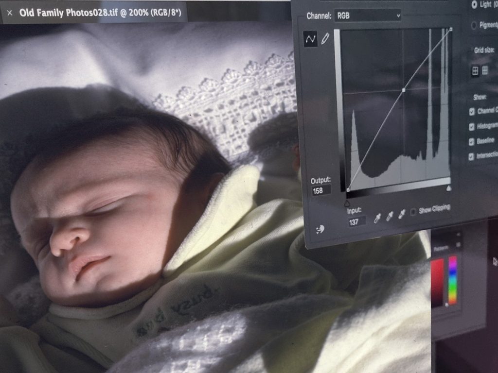 photo of a sleeping baby on a computer screen with volume analytics to the right of it.