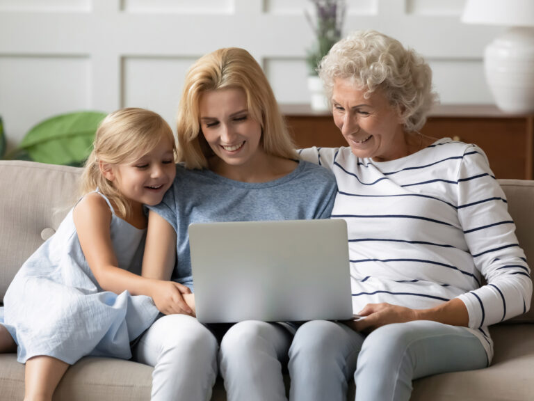 family sitting together watching a Supaphoto transfer