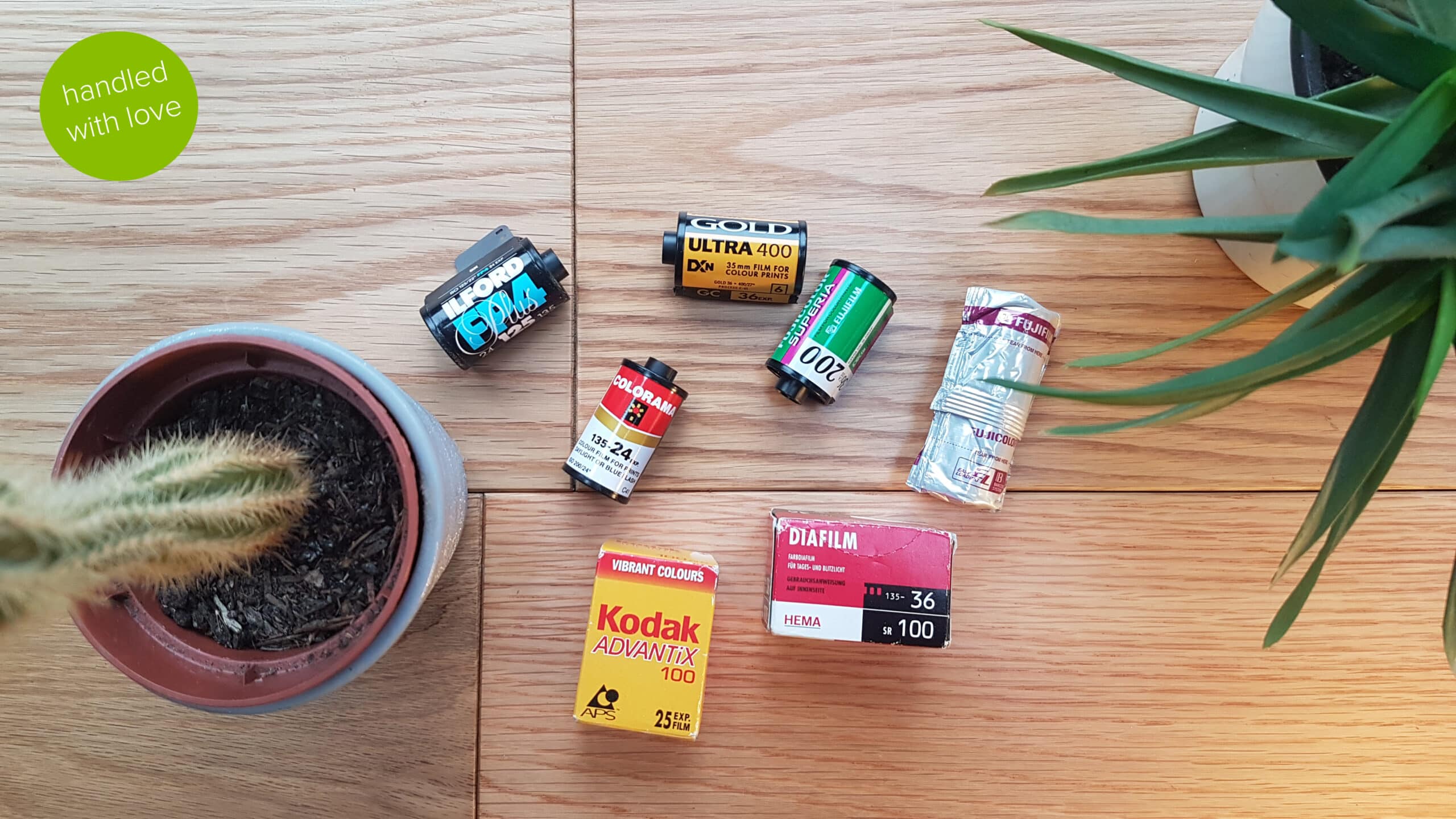 a selection of undeveloped film rolls including 35mm film. Digital Conversion Service