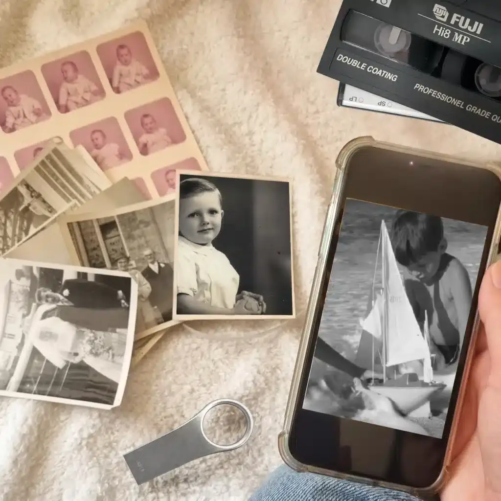 Close up of converted media on a mobile phone and a USB memory stick