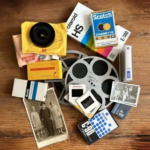 Close up of different media that we convert including VHS, camcorder tape, cine reels, photos, 35mm slides and audio tapes
