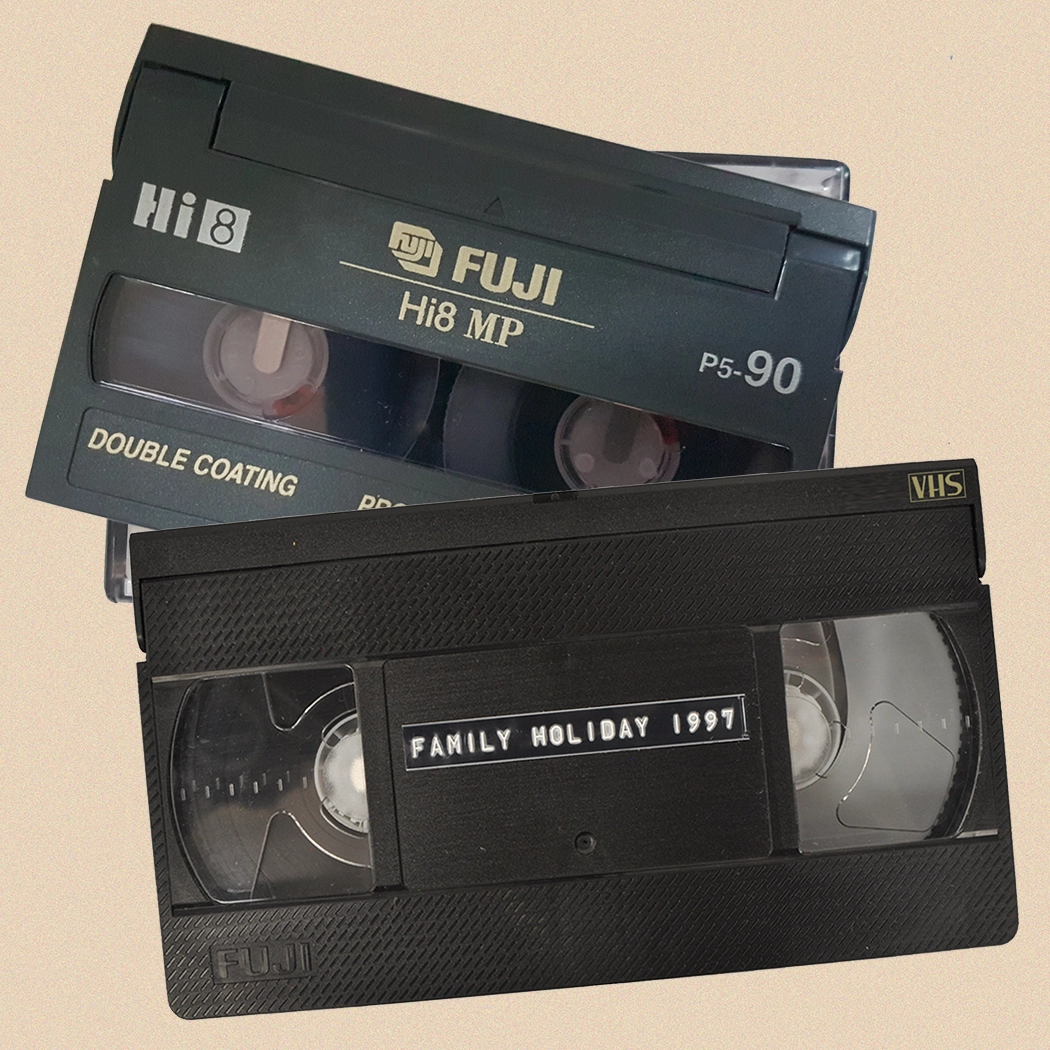 Close up of a VHS tape and a 8mm camcorder tape - Video to DVD Service