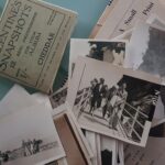 Old Photos Strewn Against Photo Wallets from 1940s