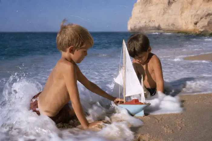 boys on beach with toy boat - to show what we can do when we digitise photos