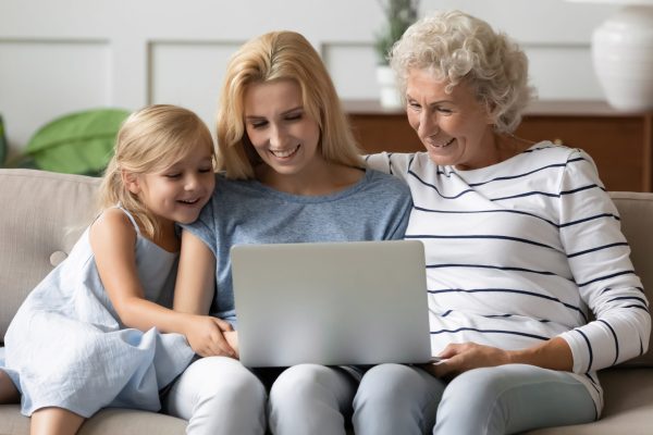 family sitting together watching a Supaphoto transfer